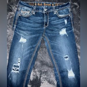 Women’s distressed rock revival jeans size 31.